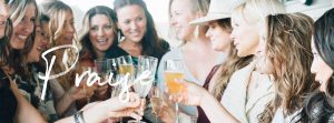 Image of women toasting together at womens retreat with overlaid text reading "praise"